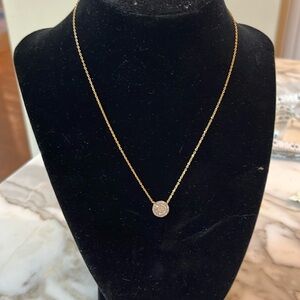 Gold necklace with sparkling pendant